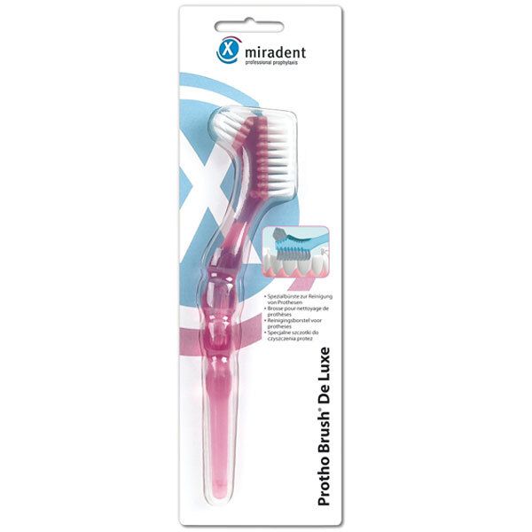 Roze Protho Brush® De Luxe in blisterverpakking. Borstelkop met witte borstelharen. Miradent-logo bovenaan.
