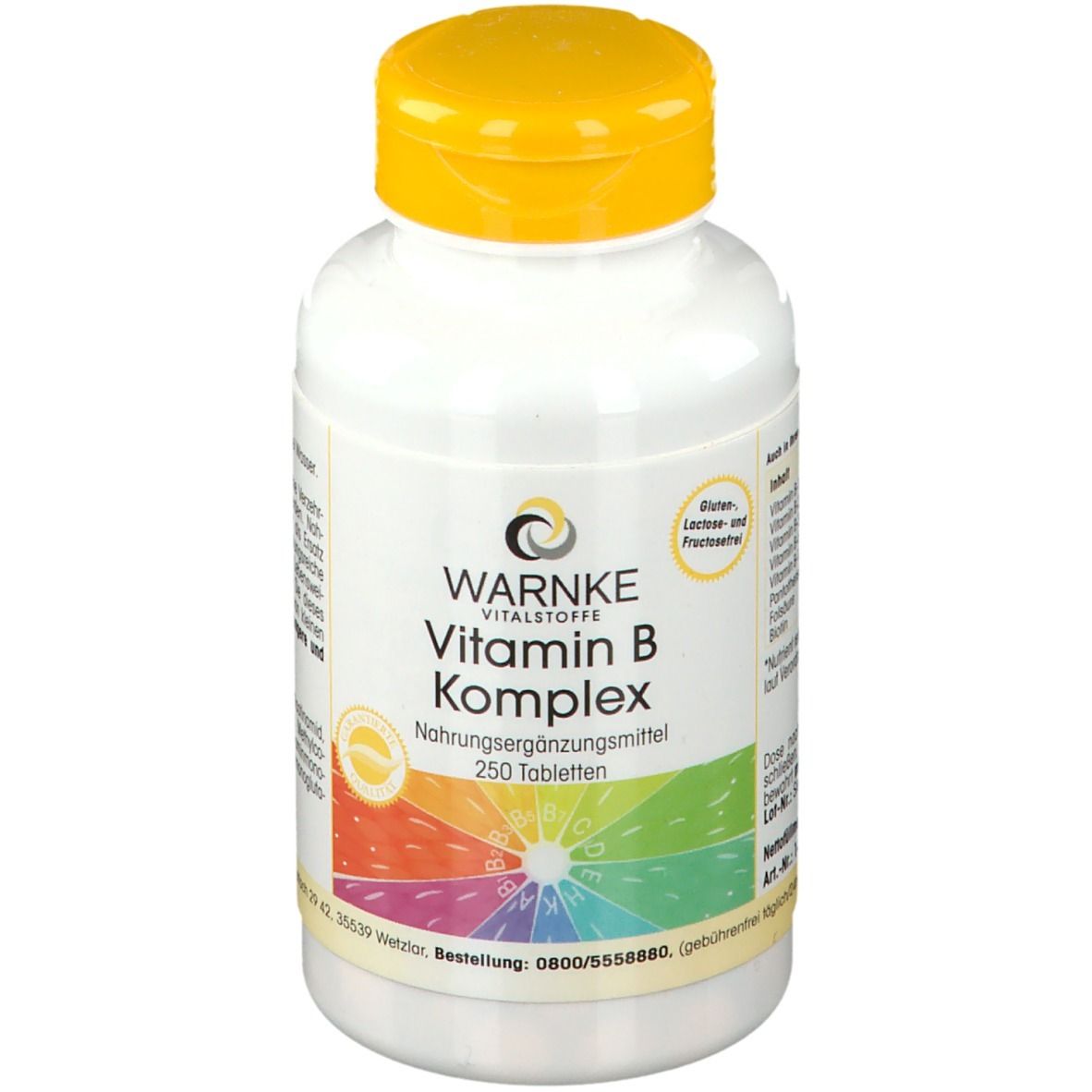 Witte fles met gele dop. Opschrift: WARNKE Vitamin B Komplex, 250 tabletten. Kleurrijke regenboog.