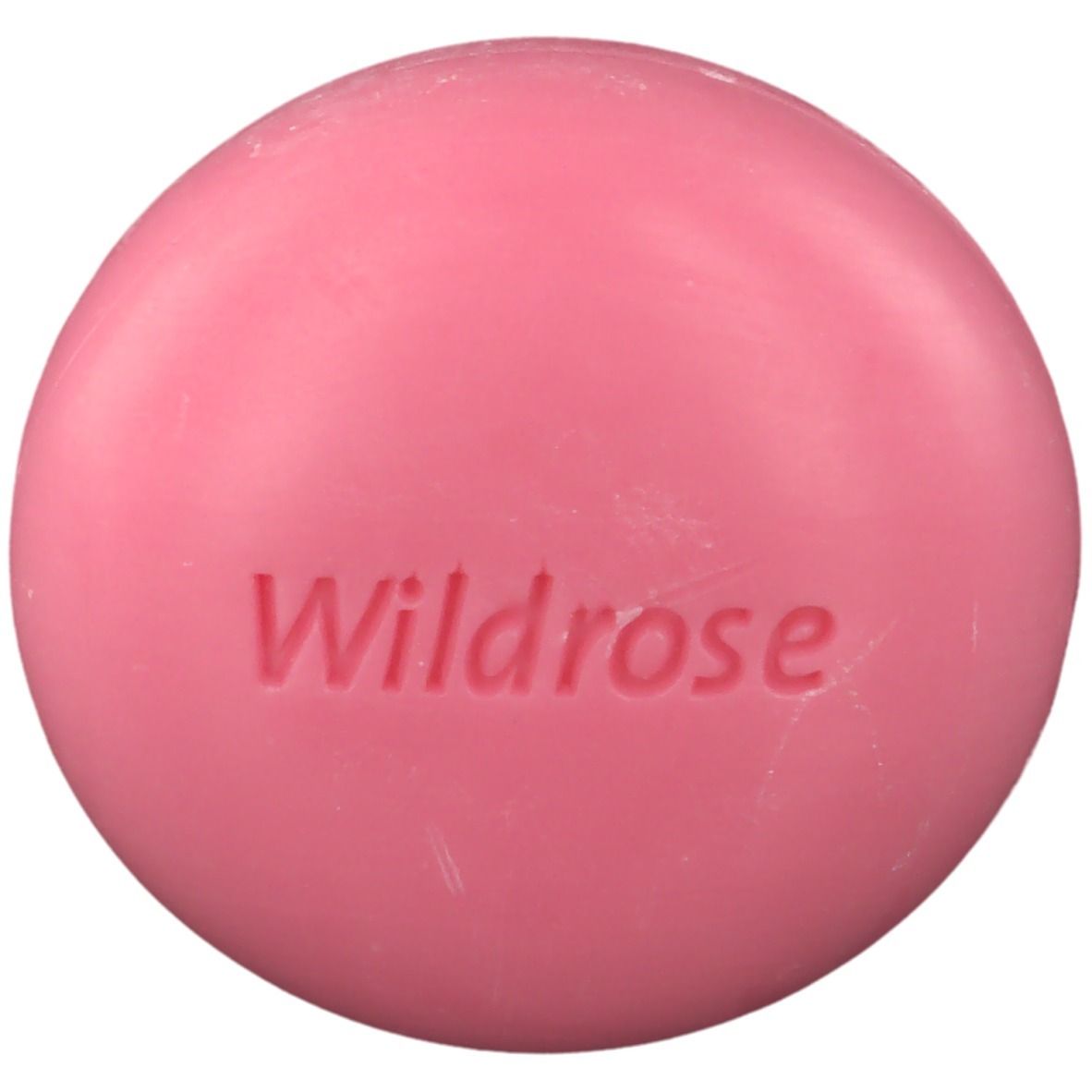 Roze ronde zeep met "Wildrose" in reliëf.