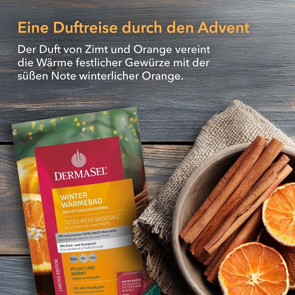 Emballage du produit et bâtons de cannelle, tranches d'orange dans un bol en bois. DermaSel Bain de Chaleur Hivernal. Texte : cannelle et orange.