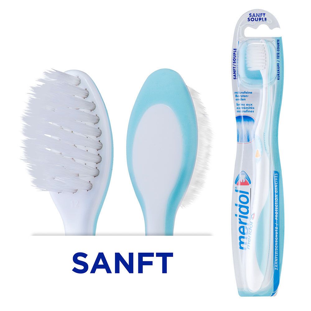 Tandenborstel met blauw handvat en witte borstelharen. Opschrift: SANFT. Merk meridol.