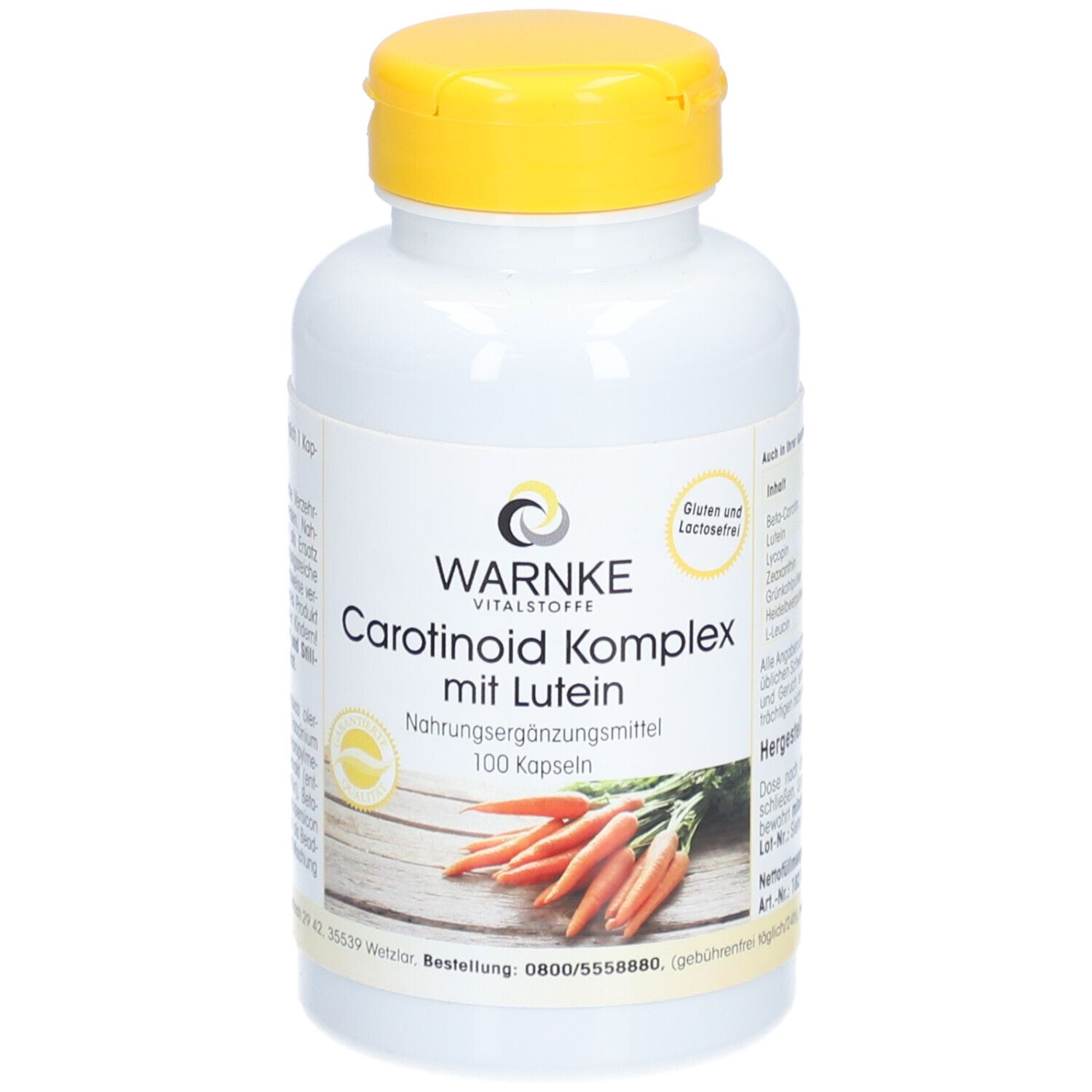 Witte fles met gele dop. Opschrift: WARNKE Vitalstoffe, Carotenoïde Komplex mit Lutein, 100 capsules. Afbeelding van wortelen.
