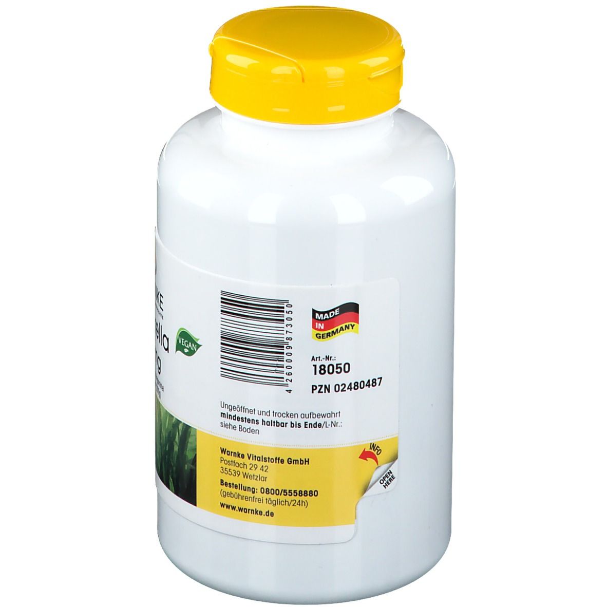 Achterkant van de witte fles met gele dop. Opschrift: WARNKE. Made in Germany. Vegan-zegel. Artikelnummer.