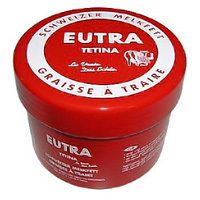 Rode pot met witte deksel. Opschrift: Eutra Tetina, Zwitserse Melkfett, Graisse à Traire.