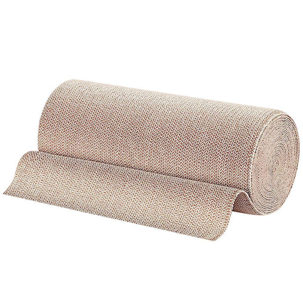 Gerolde Pütterbinde, beige. Geweven materiaal. Verband gedeeltelijk afgerold.
