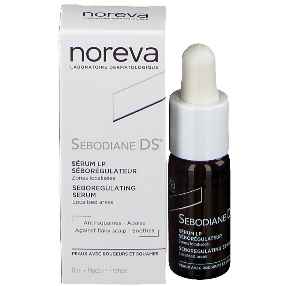 Produit et emballage. Flacon brun avec bouchon et pipette blancs, à côté d'une boîte blanche. Inscription: Noreva, Sebodiane DS.