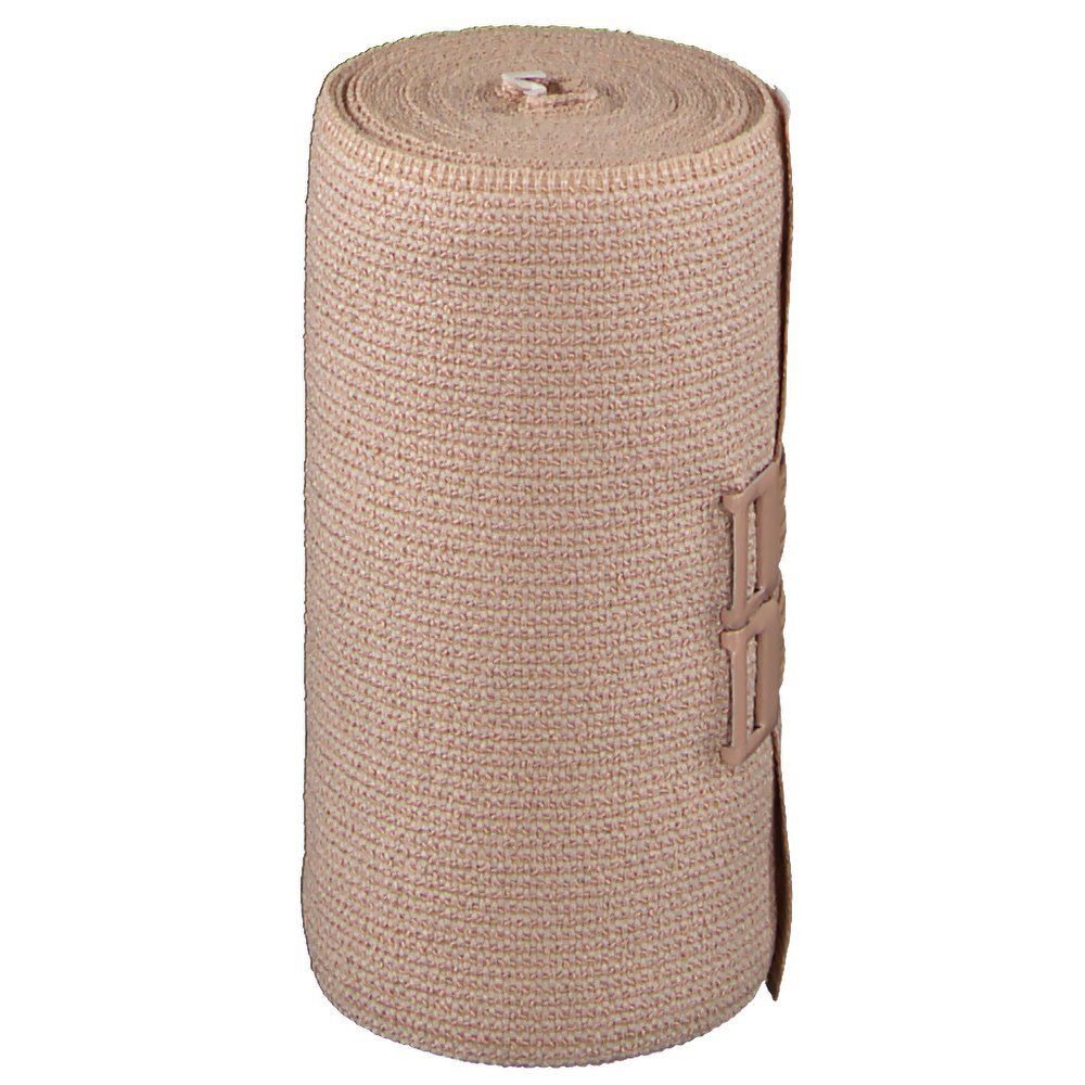 Bande de compression beige enroulée. Avec fermeture. Sans marquages ni logos visibles.