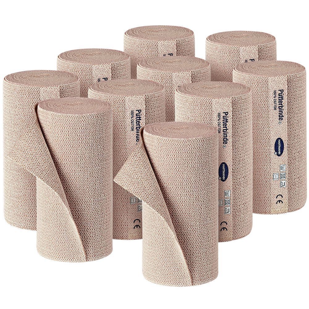 Negen opgerolde Hartmann Pütterbindes®. Beige, van stof. Opschrift: Pütterbinde. CE-markering.
