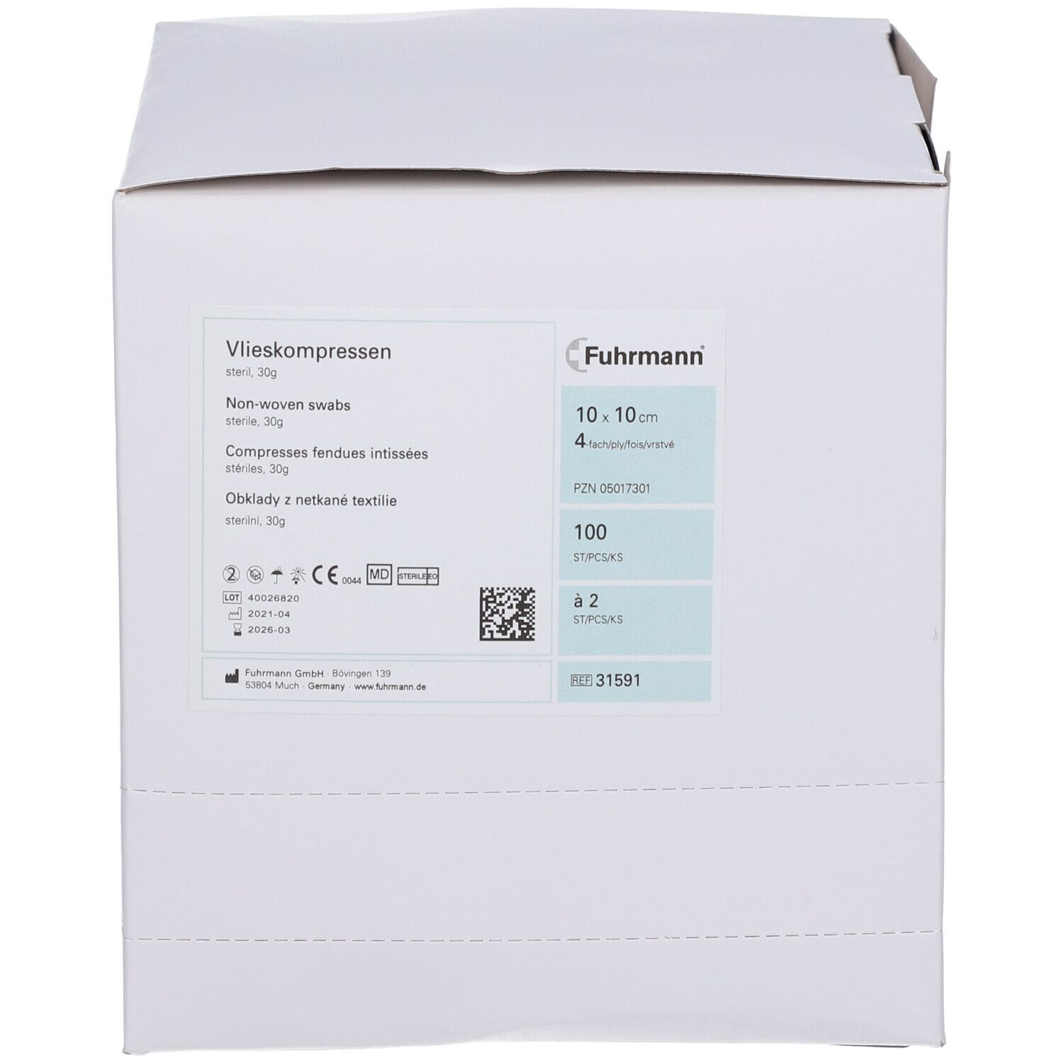 Witte kartonnen verpakking met productinformatie. Opschrift: Vlieskompressen, 10 x 10 cm, steriel. Merk: Fuhrmann. Bevat 100 stuks.