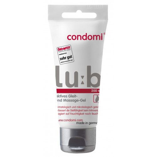 Tube blanc avec "condomi" et "Lu:b". Label "ÖKO-TEST". Texte "200 ml" et "aktives Gleit- und Massage-Gel".