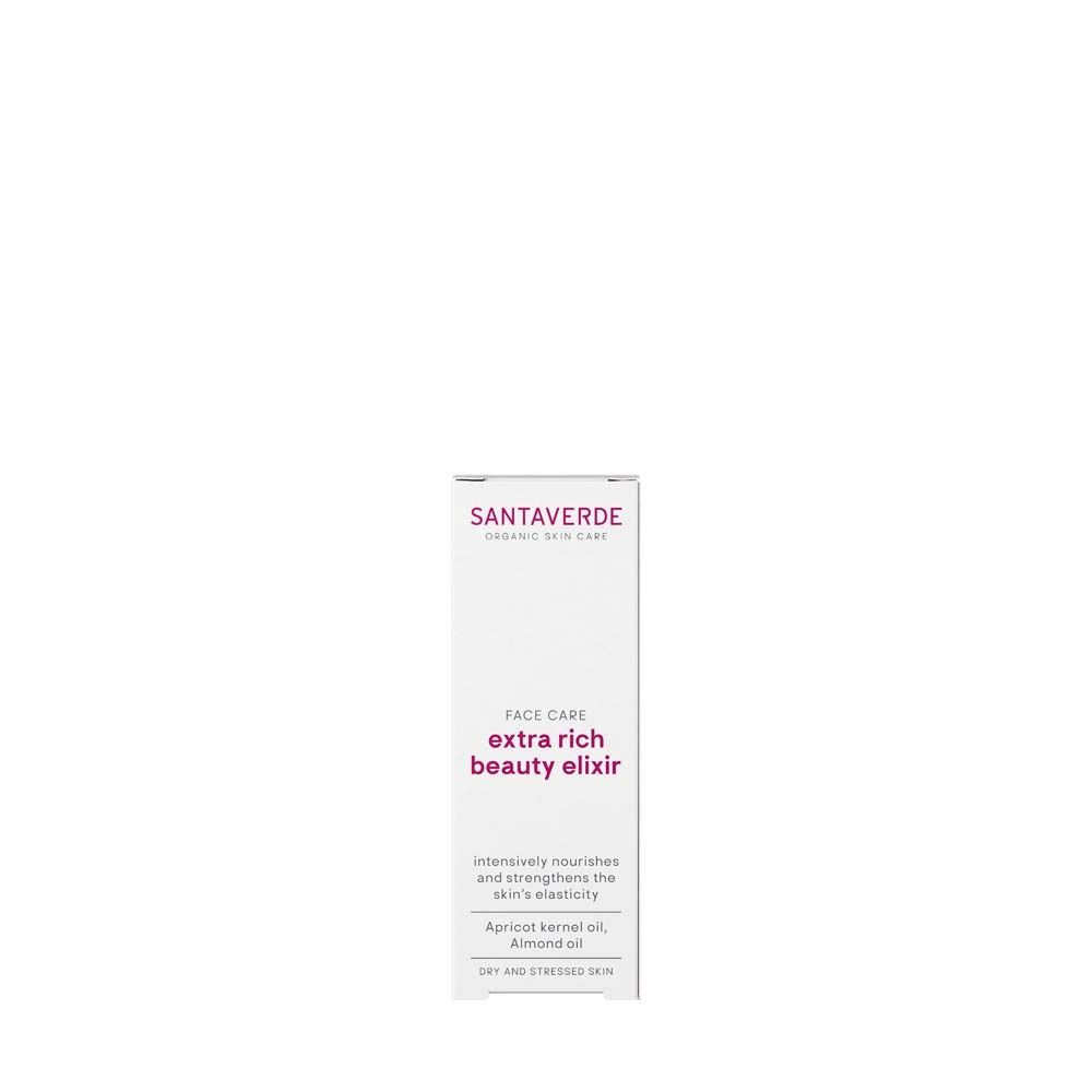 Productverpakking. Witte doos met productnaam en merk. Tekst: extra rich beauty elixir. Voor de droge huid.