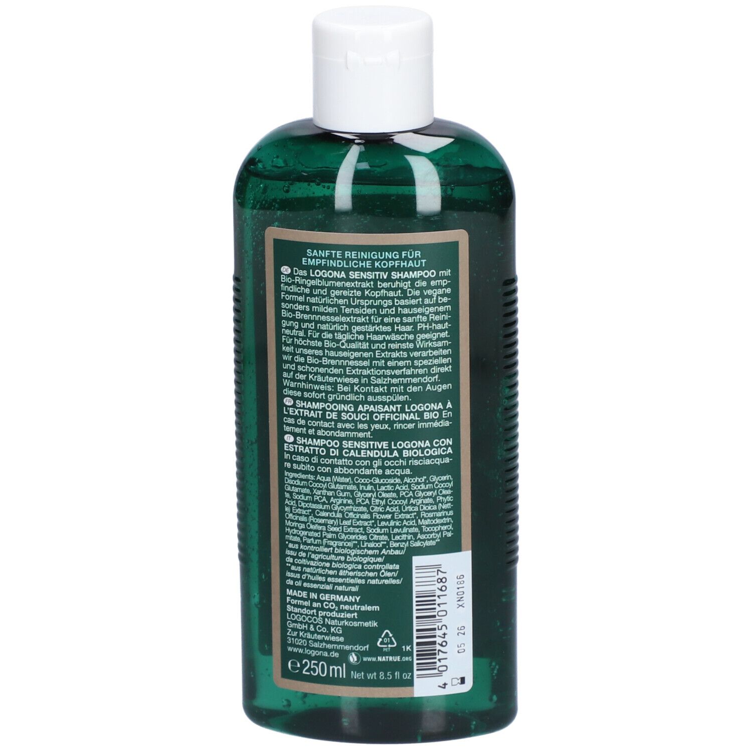 Achterkant van een groene shampoo fles. Tekst in meerdere talen, waaronder Duits, Frans, Italiaans. Ingrediënten.