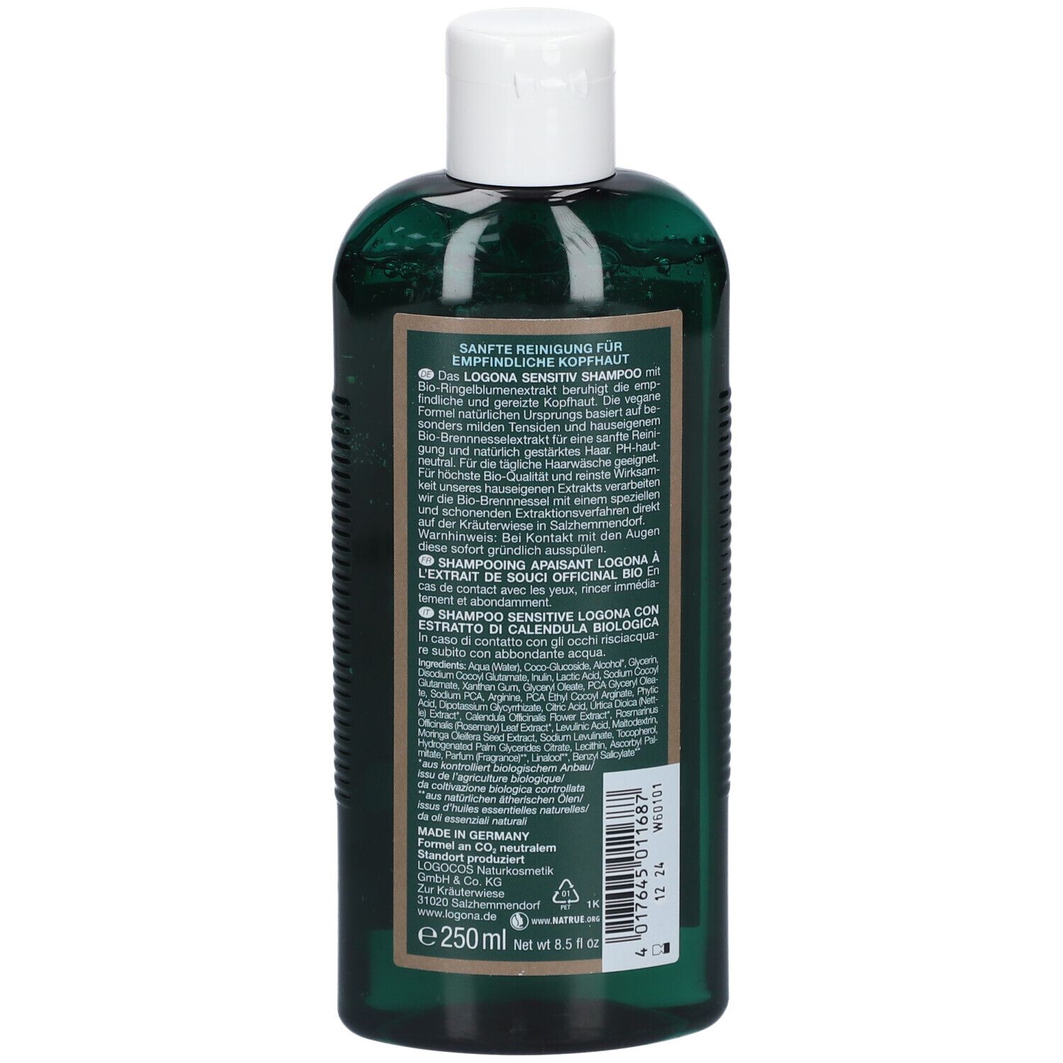 Achterkant van een groene shampoo fles. Tekst in meerdere talen, waaronder Duits, Frans, Italiaans. Ingrediënten.