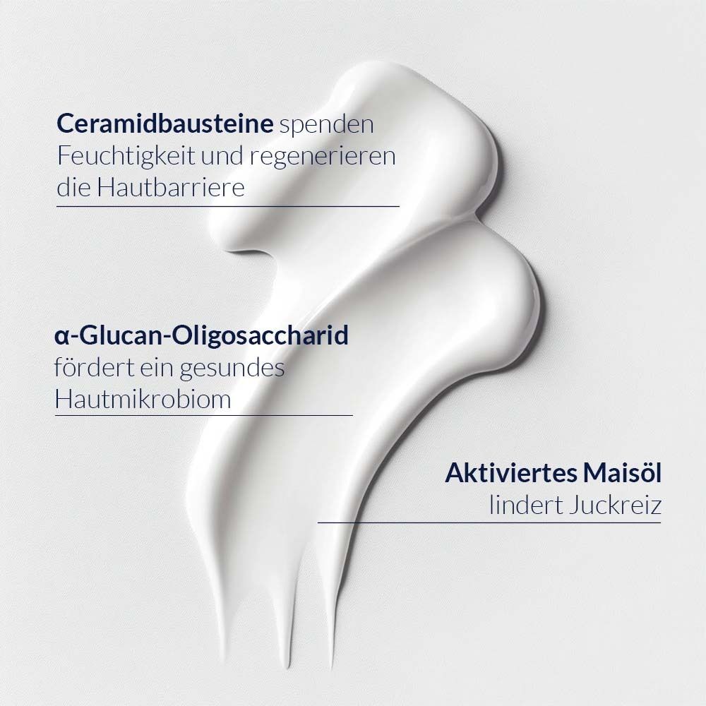 Fil de crème blanche. Texte : Les céramides hydratent, α-Glucan-Oligosaccharide favorise le microbiome, l'huile de maïs active apaise les démangeaisons.