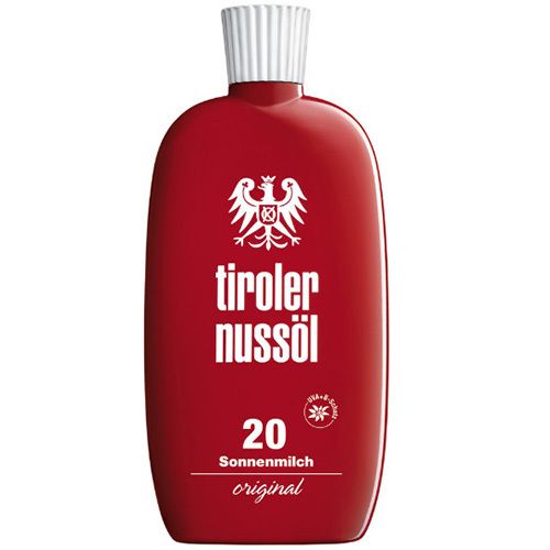 Flacon rouge avec bouchon blanc. Inscription : Tiroler Nussöl, 20 Sonnenmilch original. Logo avec aigle.