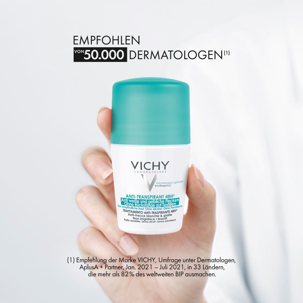 Vichy Anti-Transpirant 48h Roll-on avec bouchon turquoise, tenu par une main.