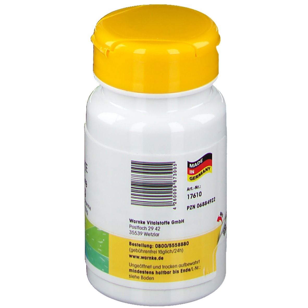 Dos du flacon de comprimés. Code-barres, informations fabricant, Made in Germany. Autocollant jaune avec texte.