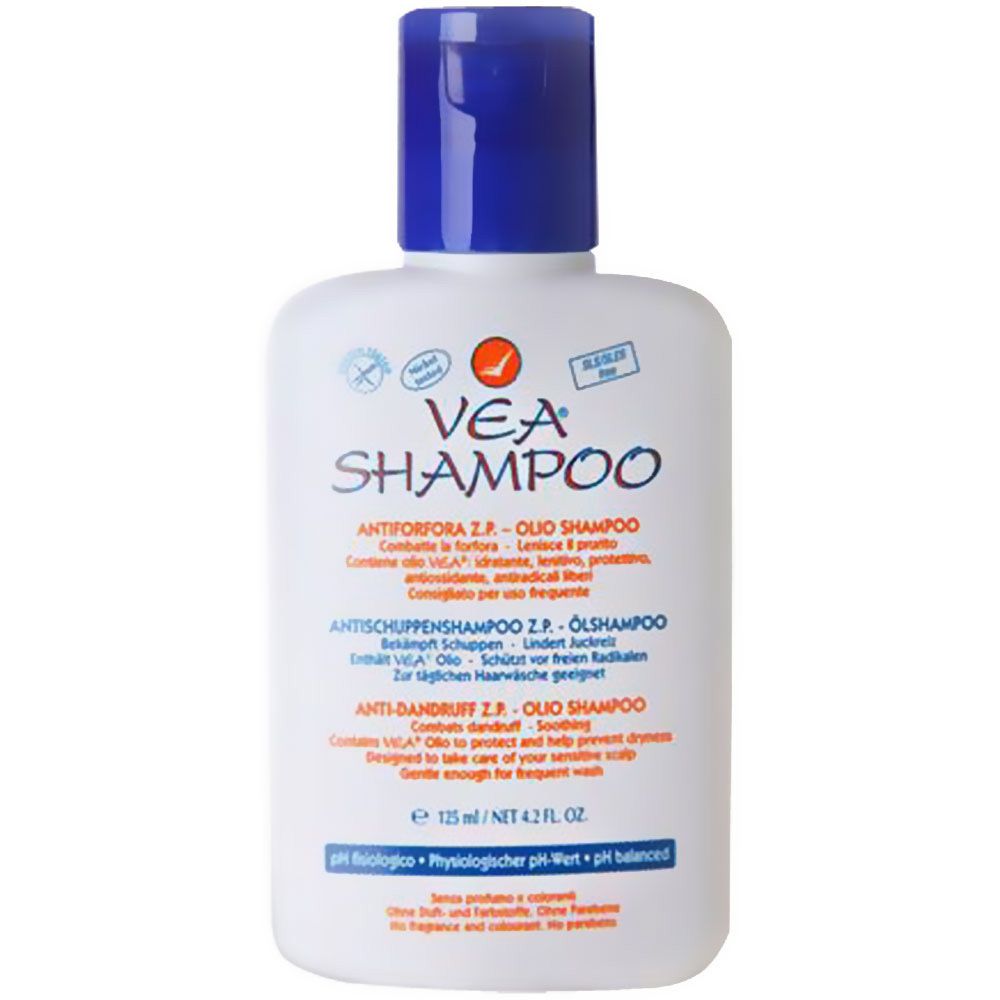 Witte fles met blauwe dop. Opschrift VEA Shampoo. Tekst in meerdere talen. Oranje logo.