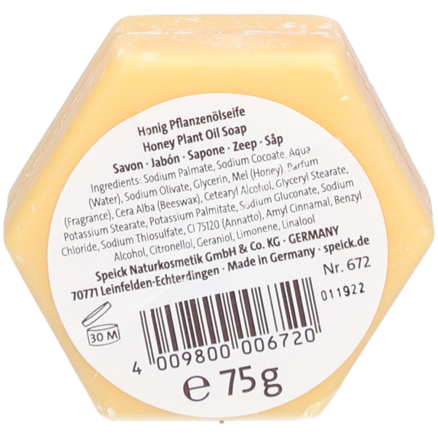 Savon en forme de nid d'abeille avec étiquette. Inscription : Honig Pflanzenölseife, 75g. Contient du miel et de la cire d'abeille. Fabriqué en Allemagne.