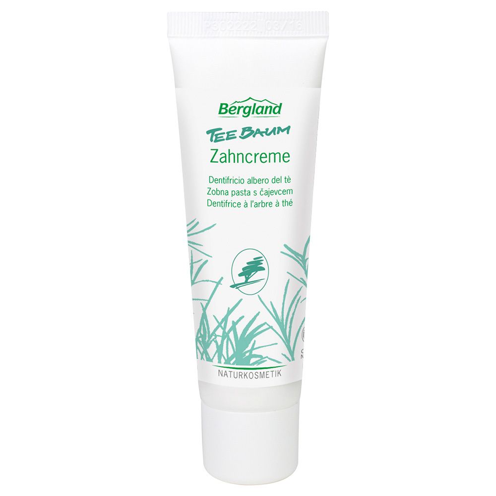 Tandpastatube met groen logo en tekst. Opschrift: Bergland Teebaum Zahncreme. Naturkosmetik.