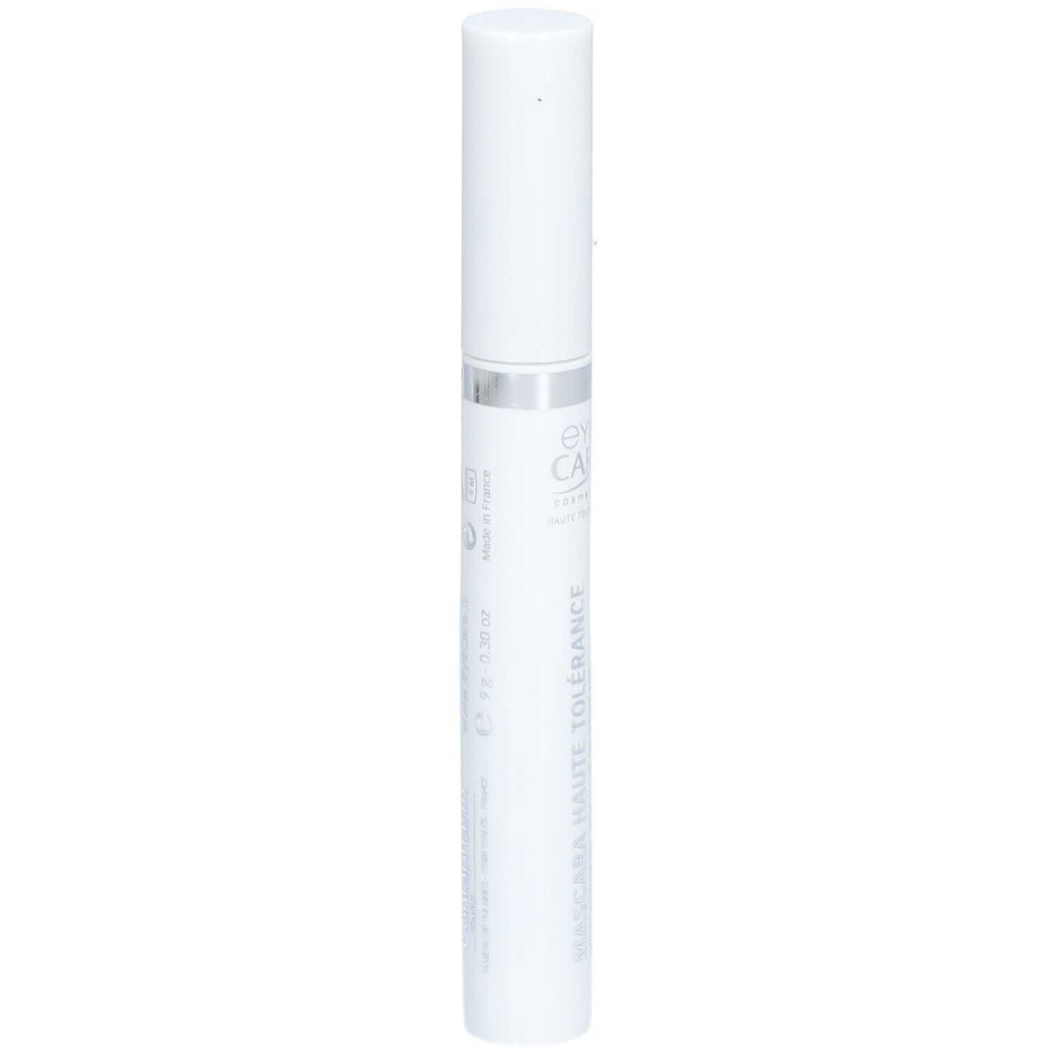 Tube de mascara blanc avec bague argentée. Inscription : Eye Care Haute Tolérance Mascara. Forme cylindrique.