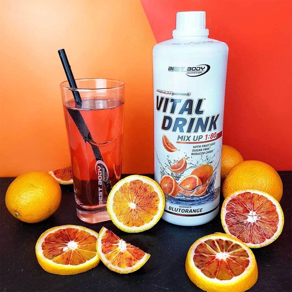 Best Body Nutrition Vital Drink Zero, Orange Sanguine, avec verre et oranges fraîches.