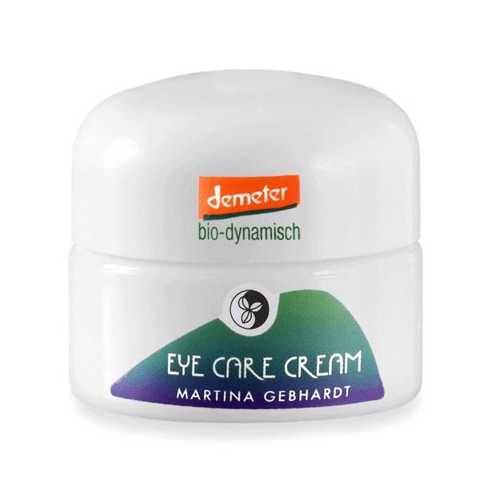 Witte crèmetiegel met deksel. Opschrift: Eye Care Cream, Martina Gebhardt. Demeter-logo. Groen-blauwe streep.