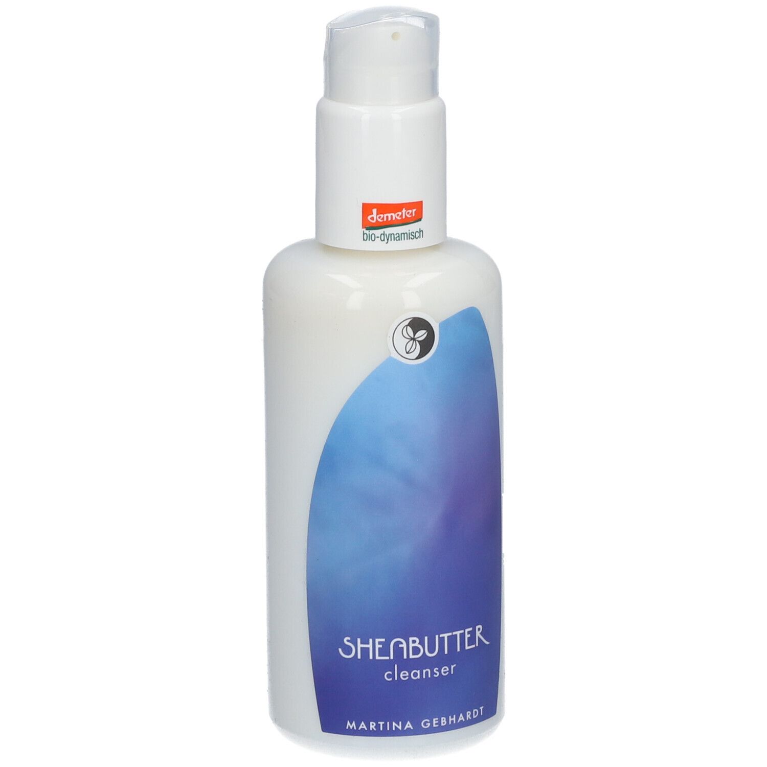 Witte fles met pomp. Opschrift SHEABUTTER cleanser en Martina Gebhardt. Demeter-keurmerk.