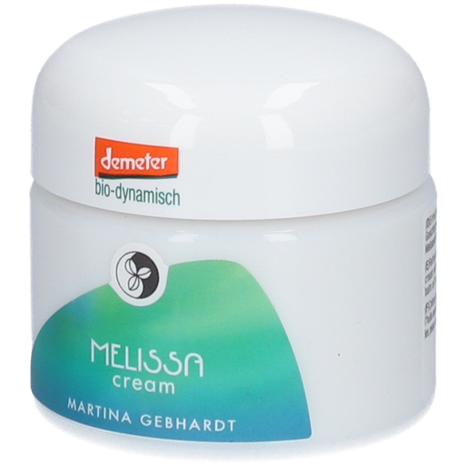Crème à la mélisse Martina Gebhardt dans un pot blanc avec sceau Demeter et graphique ondulé vert.