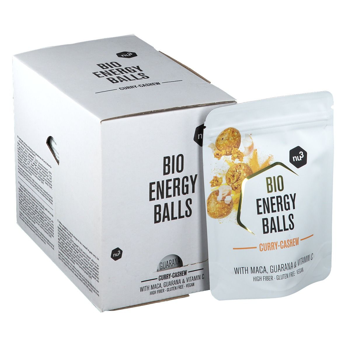 Emballage en carton blanc et sachet avec l'inscription "BIO ENERGY BALLS Curry-Cashew". Le sachet montre une image du produit et des ingrédients.