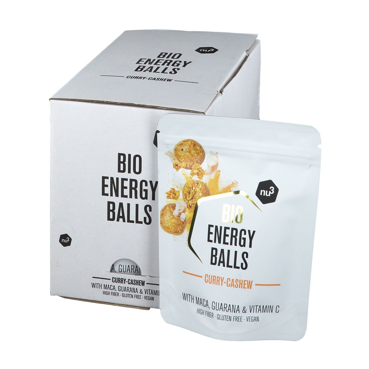 Emballage en carton blanc et sachet avec l'inscription "BIO ENERGY BALLS Curry-Cashew". Le sachet montre une image du produit et des ingrédients.