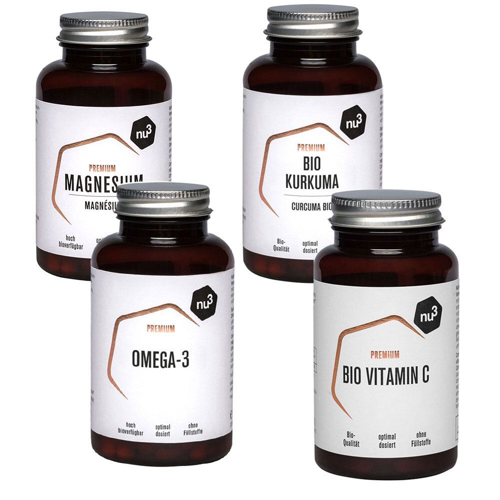 Quatre flacons bruns avec des couvercles argentés. Les étiquettes indiquent : Magnésium, Bio Curcuma, Oméga-3 et Bio Vitamine C. Le logo nu3 est visible.
