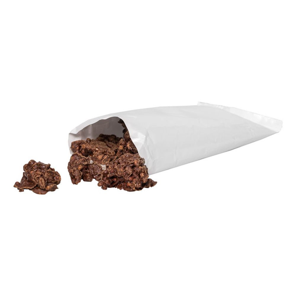 Open witte zak met Protein Crossies. Een paar Crossies liggen ernaast.