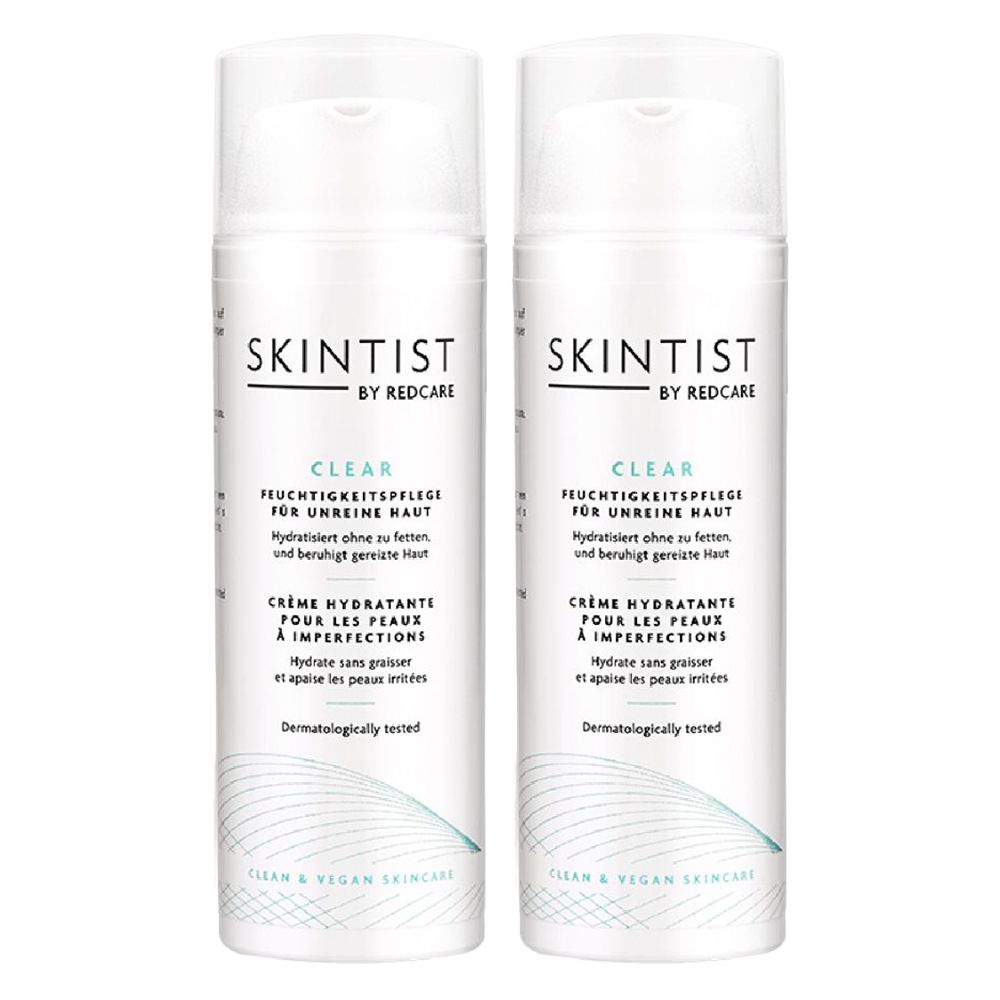 Twee witte flessen SKINTIST CLEAR Feuchtigkeitspflege. Tekst: Hydraterende crème voor onzuivere huid. Dermatologisch getest.