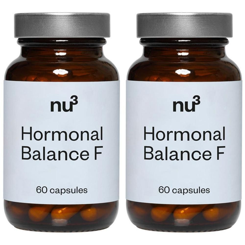 Deux flacons en verre brun avec des couvercles argentés. Les étiquettes indiquent "nu3 Hormonal Balance F" et "60 capsules".