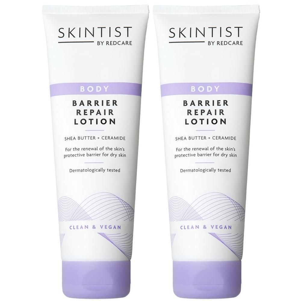 Twee tubes SKINTIST Body Barrier Repair Lotion. Gele cirkel met "1+1". Witte tubes met paarse accenten en tekst.