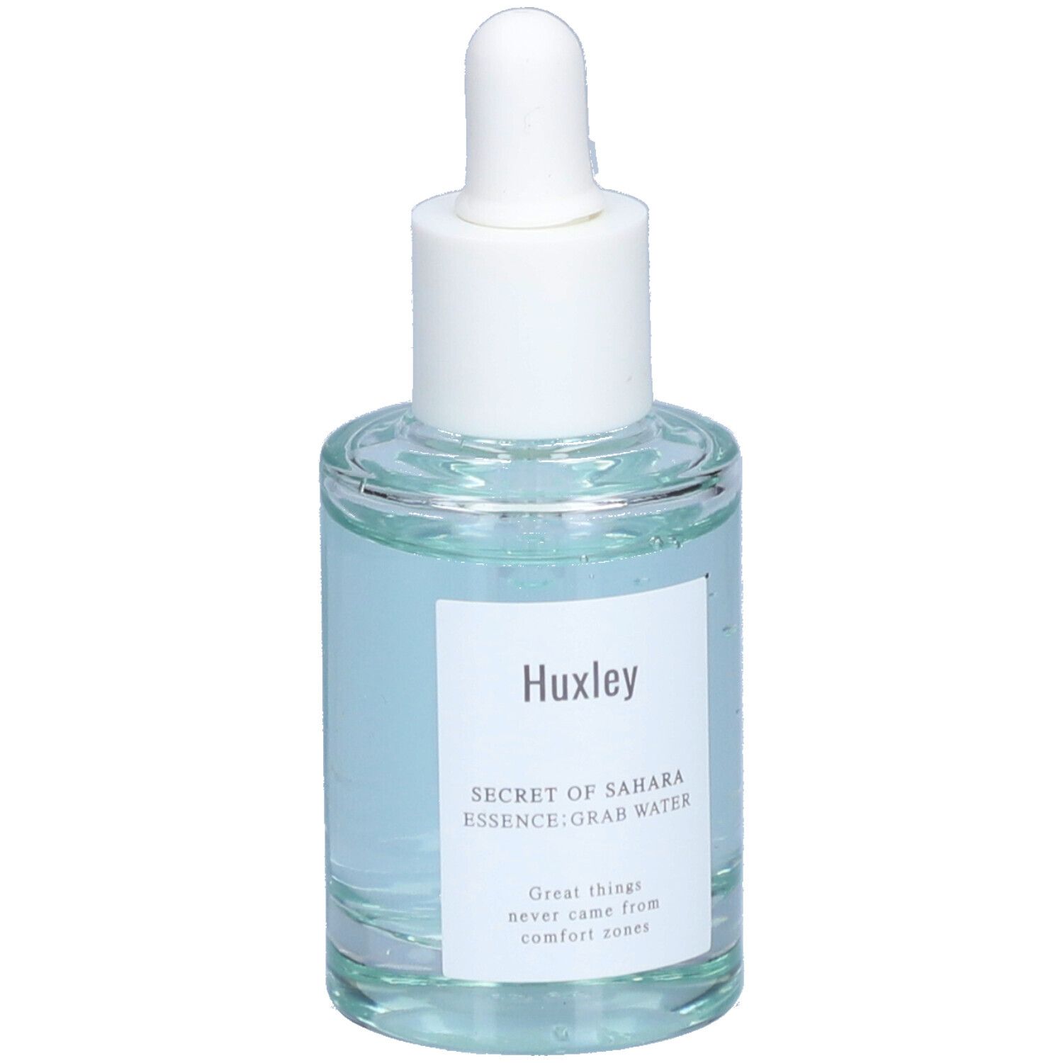 Glazen fles met blauwe vloeistof en witte dop. Etiket met "Huxley" en productnaam. Pipet.