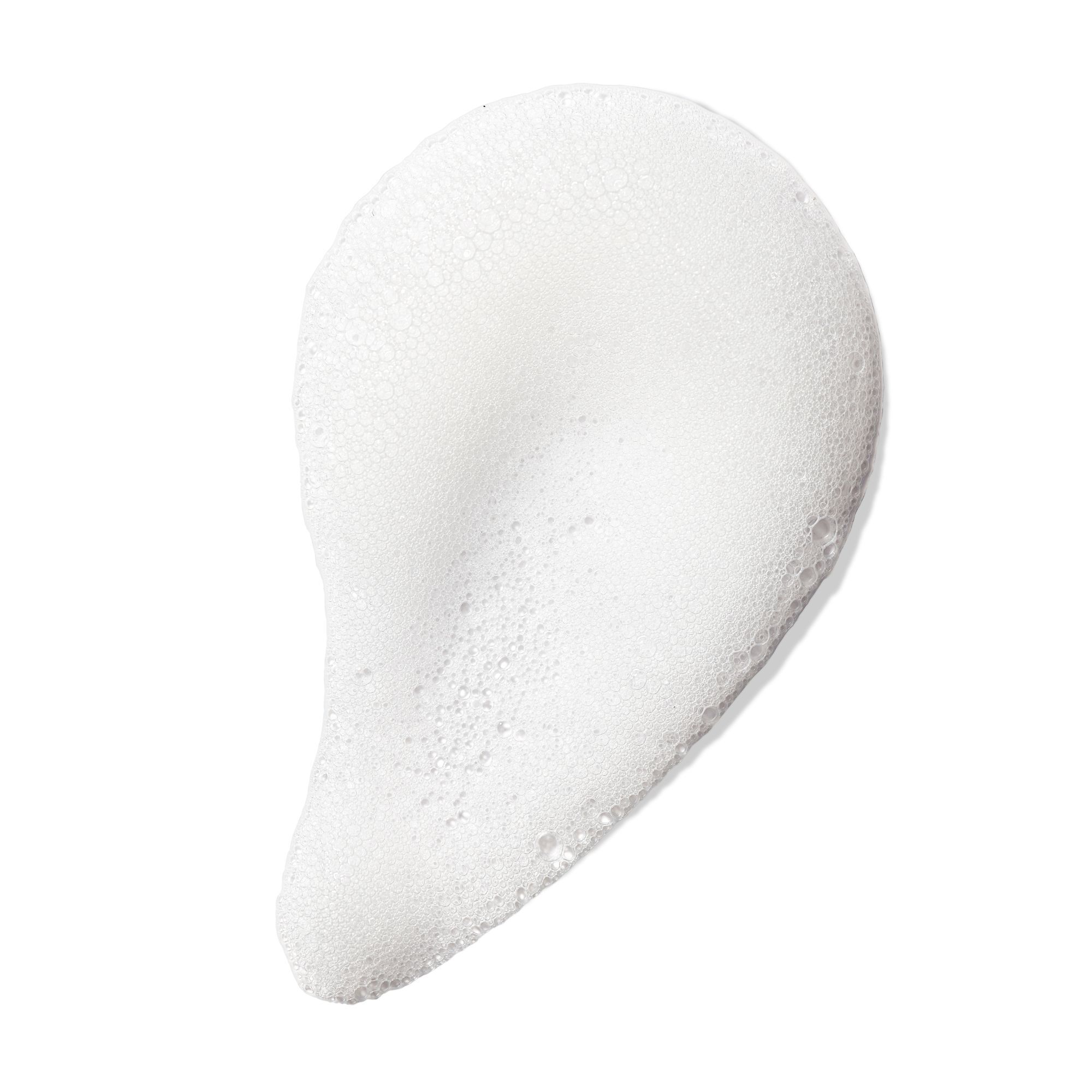 Goutte de mousse blanche sur fond blanc. Texture visible.