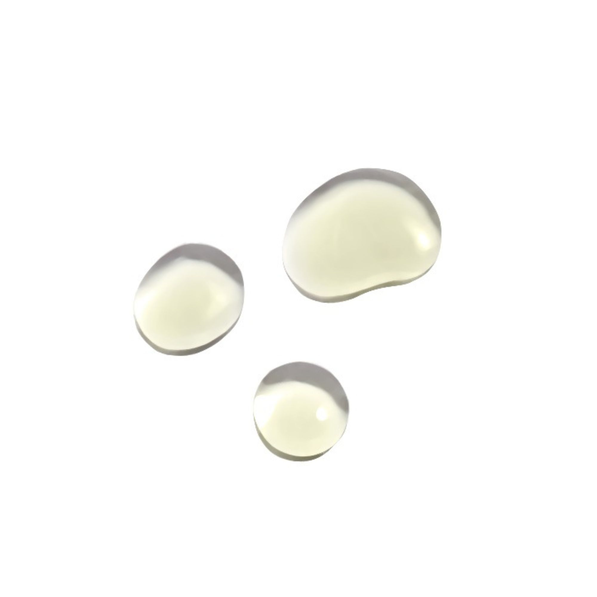 Drie druppels gezichtsolie. Lichtgele, ronde druppels op witte achtergrond.