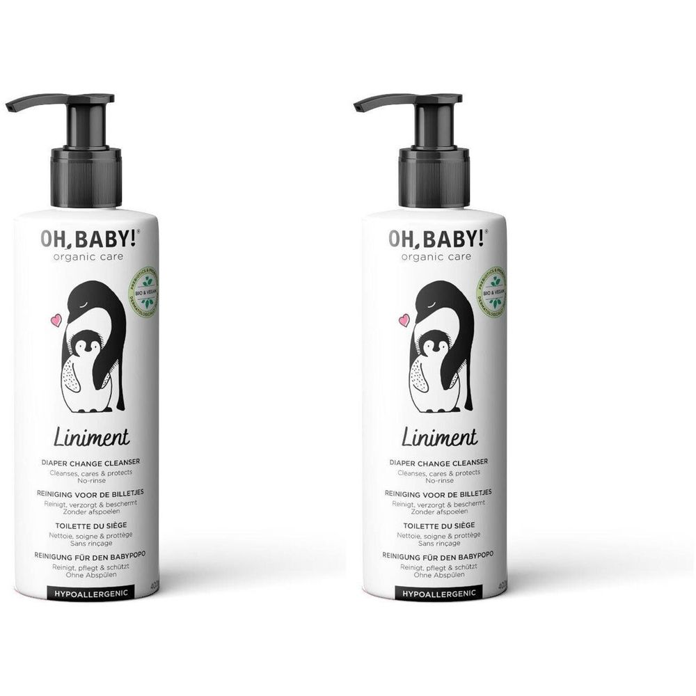 Twee flessen liniment met zwarte pomp. Opschrift: OH, BABY! en pinguïn illustratie. Hypoallergeen.