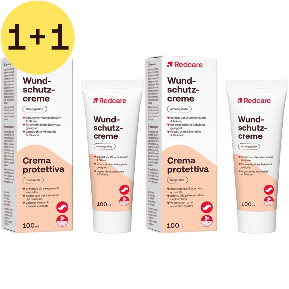 Twee verpakkingen en twee tubes Redcare crème. Witte verpakking met rode tekst. Bevat 100ml. 1+1 aanbieding.