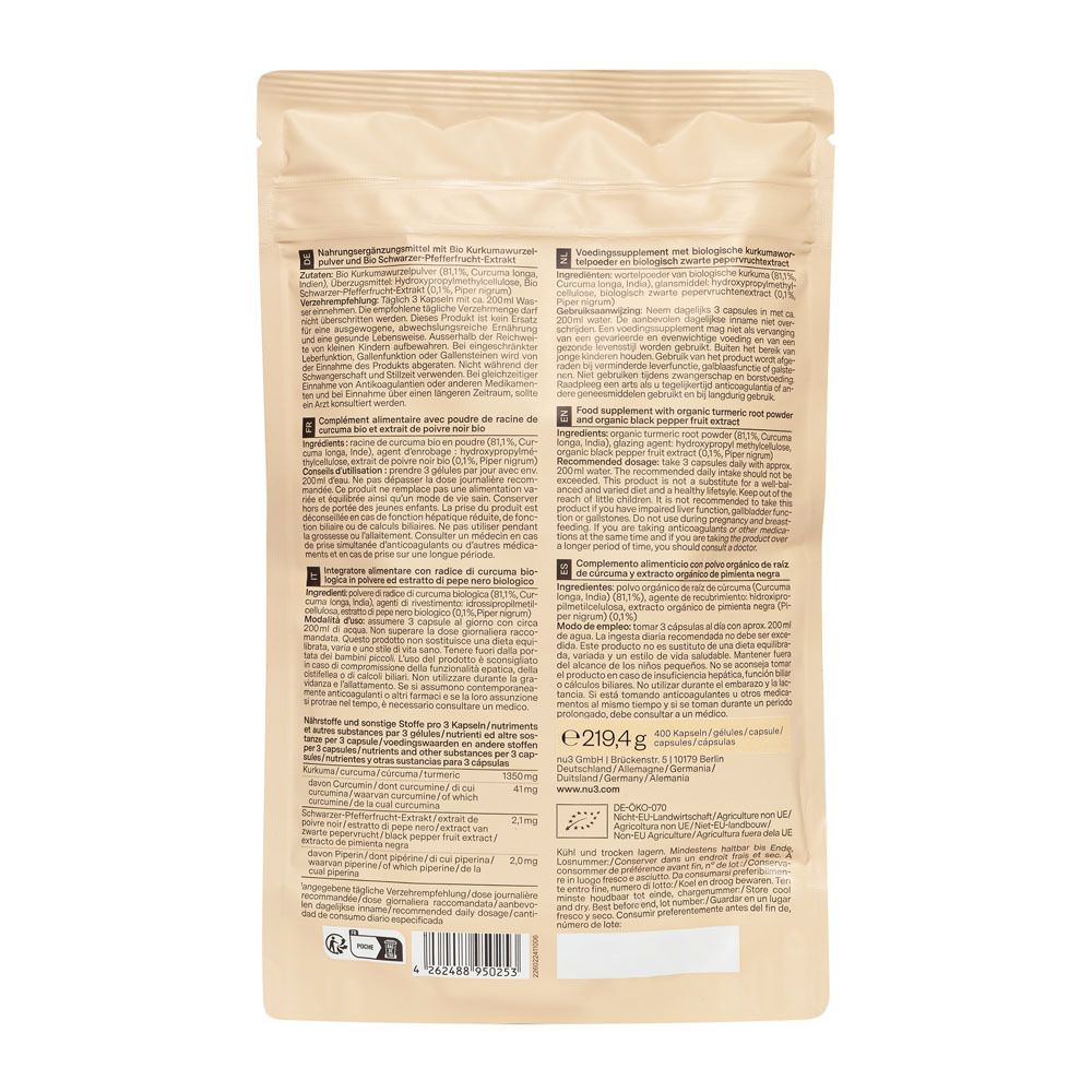 Achterkant van de beige zak met tekst in meerdere talen. Bevat informatie over het product.