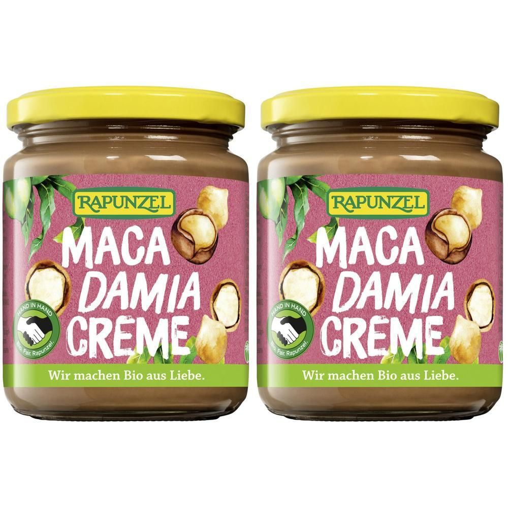 Twee potten RAPUNZEL Macadamia Crème. Bruine crème in potten met gele deksels. Etiket met tekst en macadamia noten.