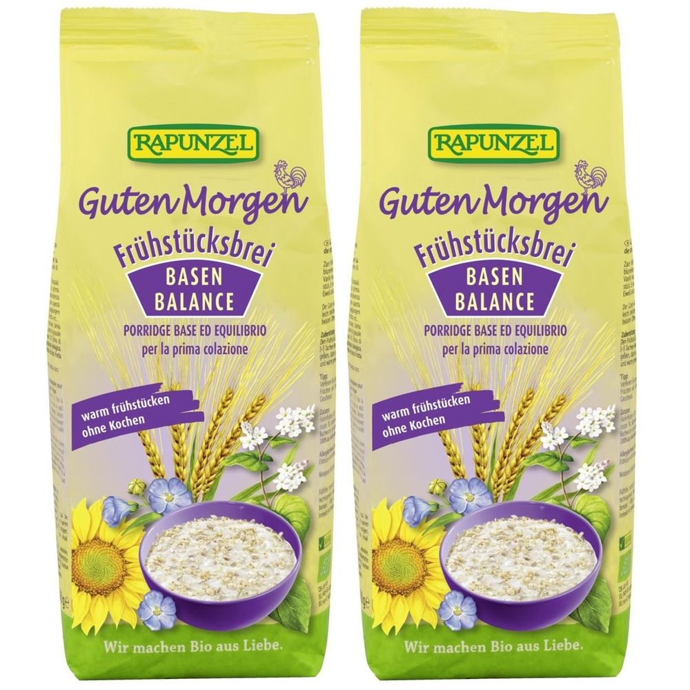 Deux paquets de RAPUNZEL Guten Morgen Frühstücksbrei, Basen-Balance. Emballage jaune avec illustration et texte.