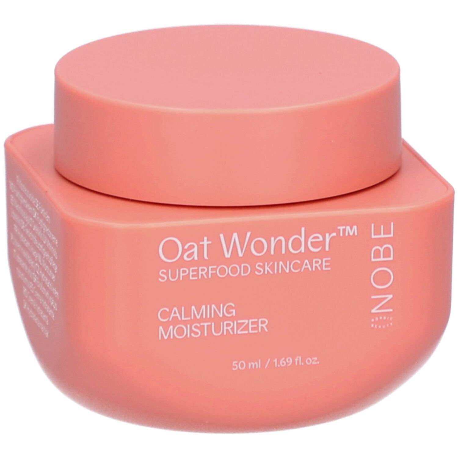NOBE Oat Wonder Kalmerende Moisturizer, 50 ml. Roze pot met deksel. "Oat Wonder", "Superfood Skincare", "Calming Moisturizer" en "NOBE" zijn erop gedrukt.