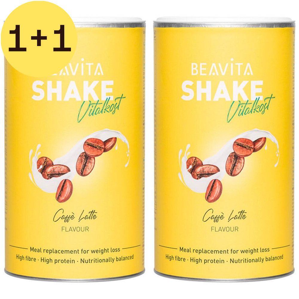 Twee gele blikken BEAVITA Shake Vitalkost Caffè Latte met 1+1 sticker. Illustratie van koffiebonen en melkspatten. Tekst: Meal replacement for weight loss.