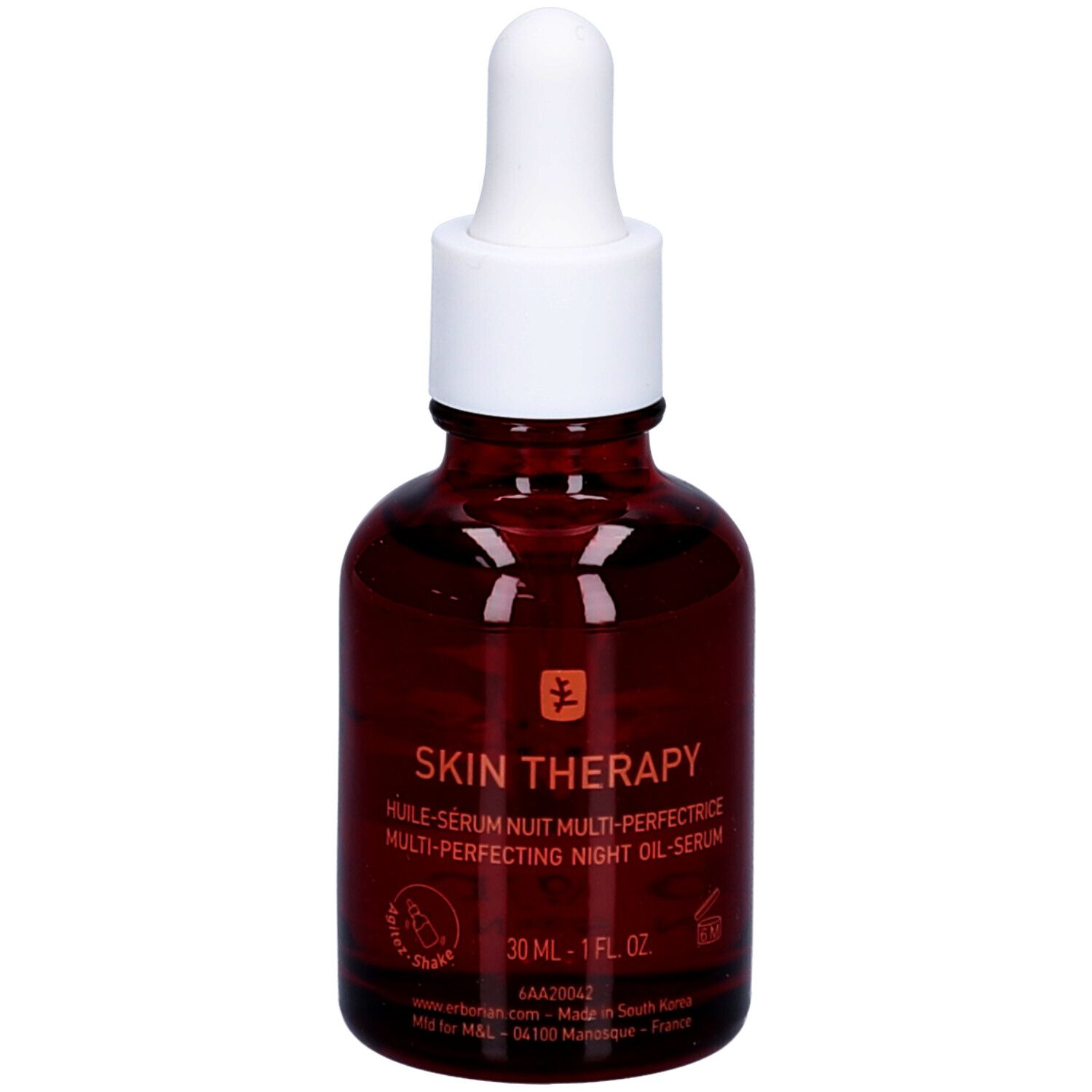 Bruine glazen fles met witte dop en pipet. Opschrift: Skin Therapy, nachtolie. Logo: boom.