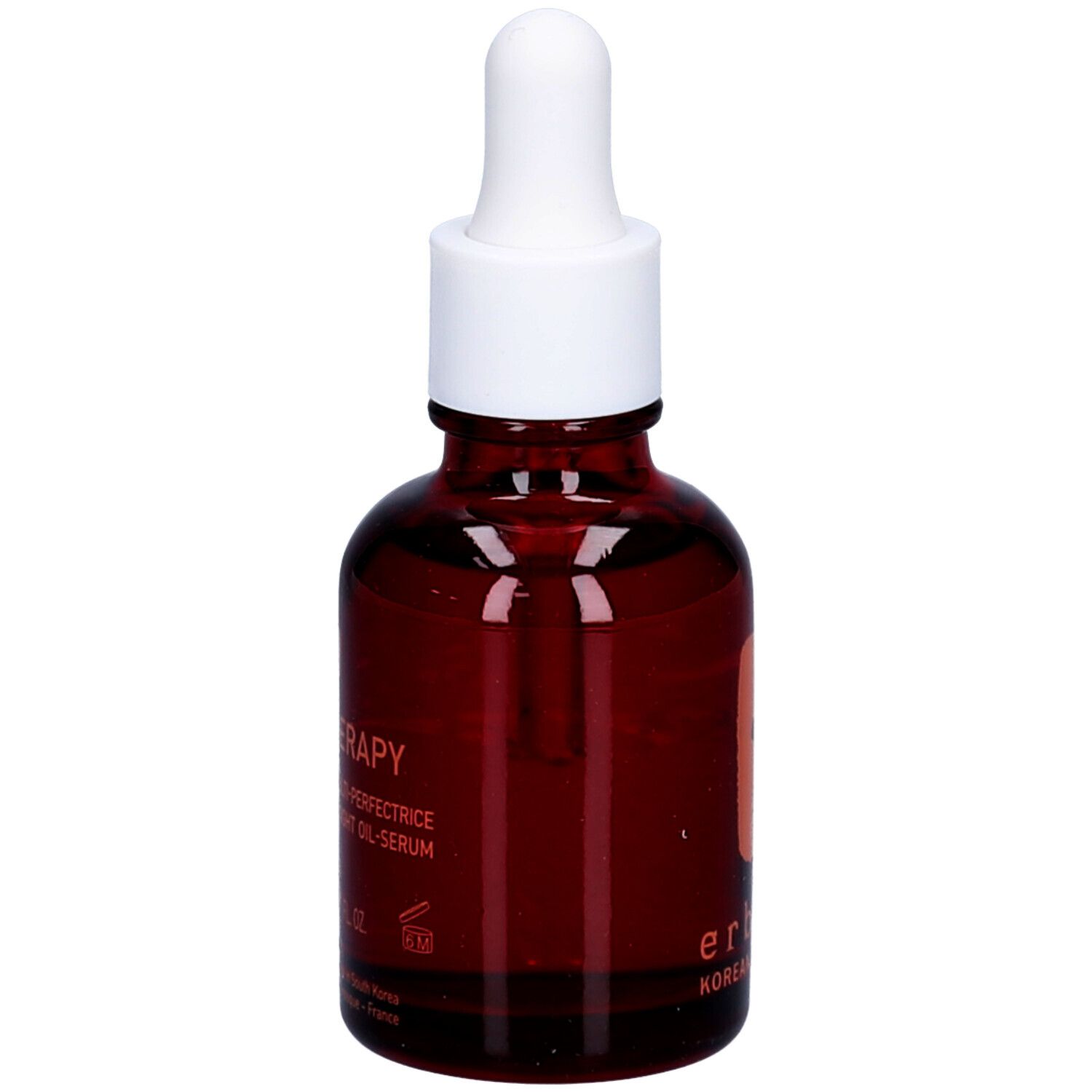 Bruine glazen fles met witte dop en pipet. Opschrift: Skin Therapy, nachtolie. Logo: boom.