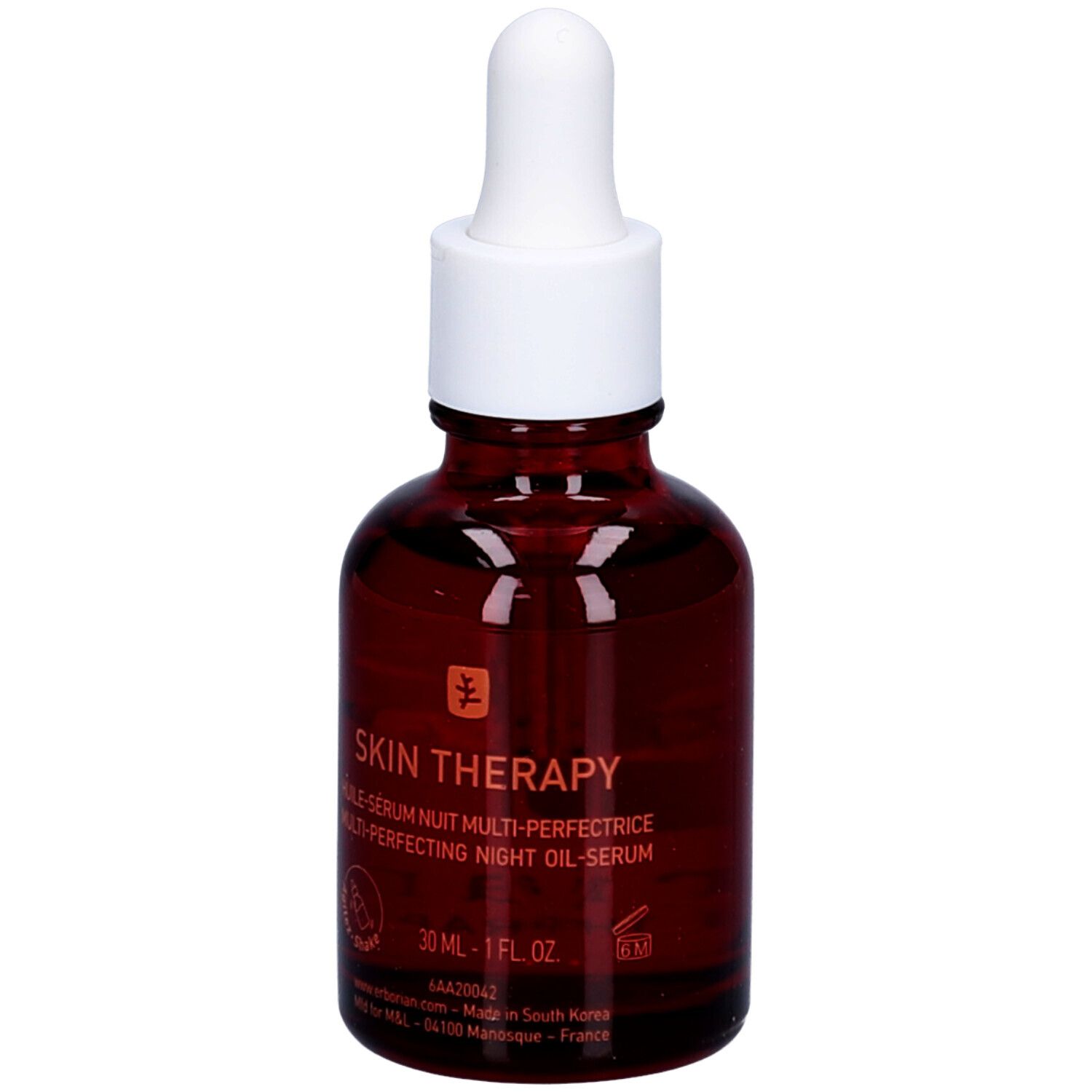 Bruine glazen fles met witte dop en pipet. Opschrift: Skin Therapy, nachtolie. Logo: boom.
