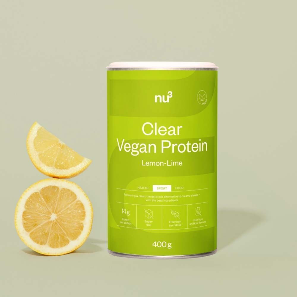 Une boîte de nu3 Clear Vegan Protein Citron-Citron Vert avec des quartiers de citron.